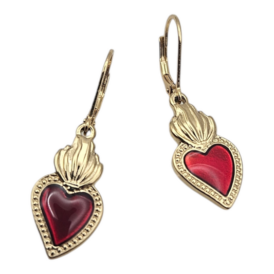 A pair of gold-plated sterling silver earrings with a sacred heart design, featuring a red enamel filling.
